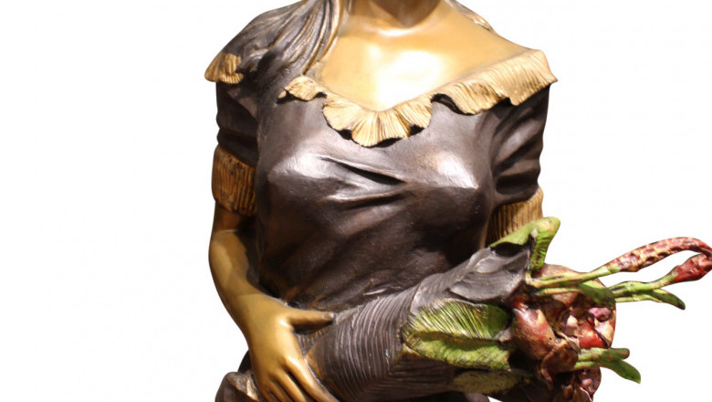 Woman Holding Bouquet Standing on Lily Bronze Statue