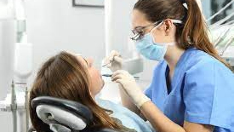 Dental Hygienist Cleaning Teeth