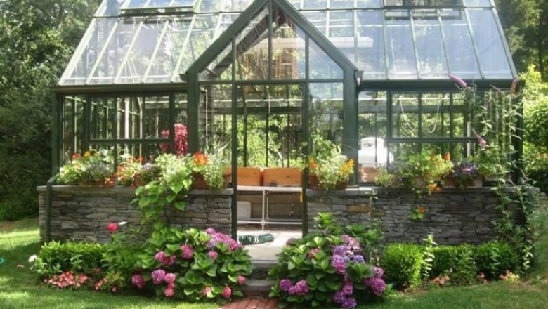 A clear or opaque cover is used to cover a High End Greenhouse construction, with the clear variant providing full visibility of the plant life inside