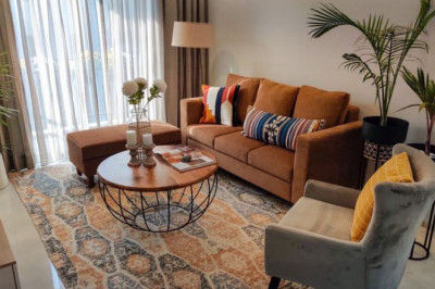 Living Room Decor with Rugs and Poufs