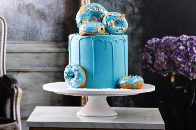 Visit Papillon Cake for the most delectable 'Blue Gold Donuts Cake'
