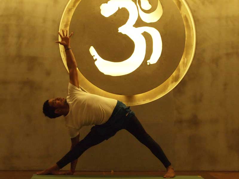 Trikonasana (Extended Triangle Pose) – Om Yoga Academy