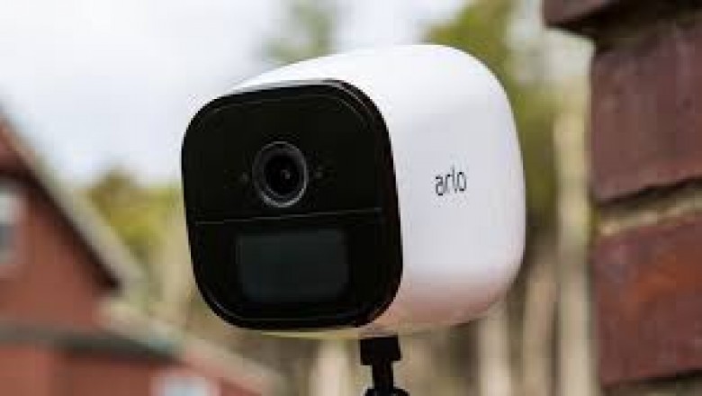 How do I set up and sync my Arlo wire-free cameras?