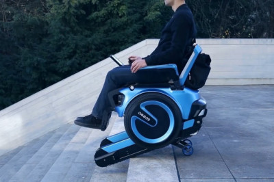 An automatic stair climbing wheelchair used by people who can't walk or have health issues that make them too weak to walk up or down stairs on their own use