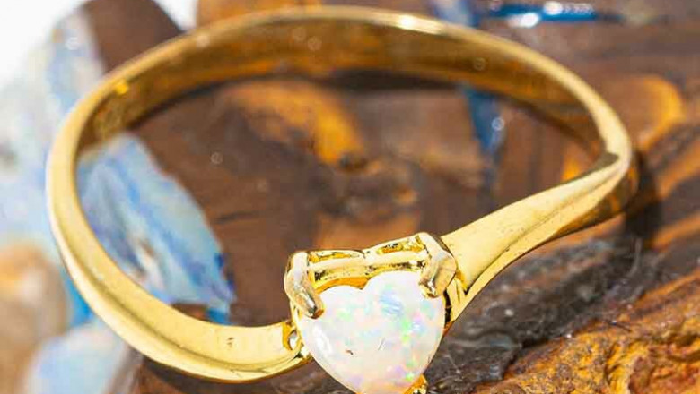 A LOVE STORY 18KT GOLD PLATED AUSTRALIAN WHITE OPAL RING