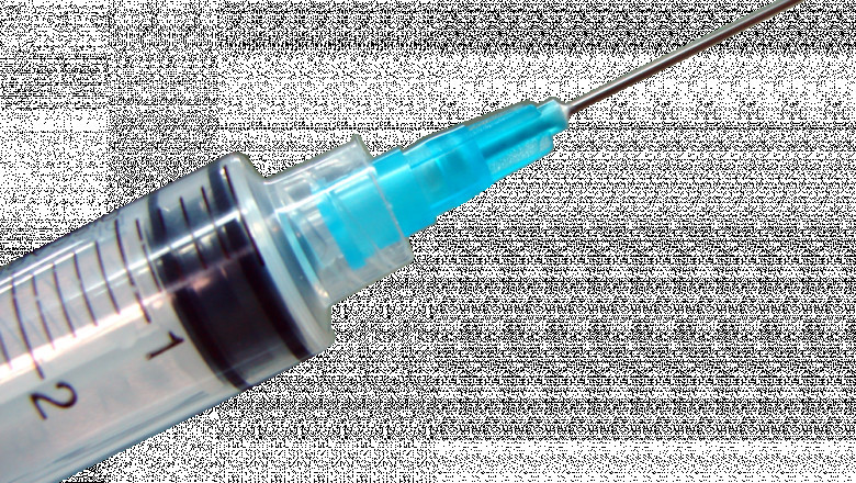 A Hypodermic Needles Penetrates The Skin Of The Patient At Its Tip With A Sharp Point.